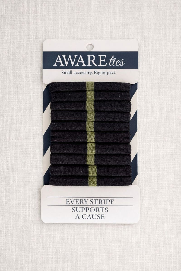 Pack of black striped ties with a visible brand label on a textured background