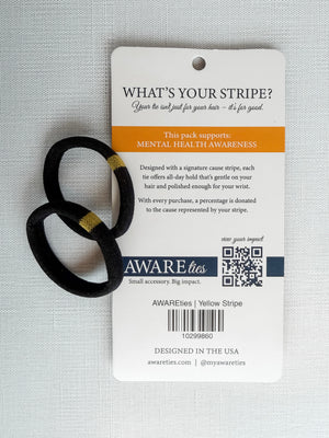 Black hair ties with a 'Aware Ties' label on a textured gray background