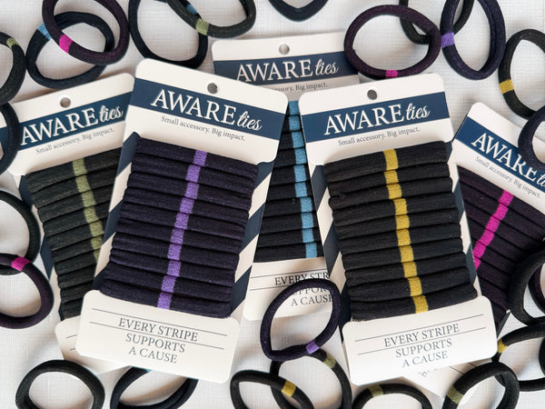 Hair ties with visible branding on packaging against a white background